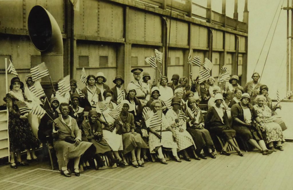 Party K before sailing from New York on July 19, 1931. The women are pictured with Col. Benjamin O. Davis, Sr. (1877-1970), who was then the highest-ranking African American in the U.S. Army. He served as Liaison Officer for all six of the black pilgrimages, overseeing the parties during their weeklong journeys to and from Europe. In the report he filed concerning the first pilgrimage, he wrote of the women: "They are returning to their homes with a feeling of gratefulness to the Government and with renewed faith in the principles upon which our Government is founded; and the feeling that their sons and husbands have not died in vain.” Davis’s own experience in World War I had been deeply frustrating; the Army, unwilling to allow him to command troops in Europe, consigned him to the Philippines. 