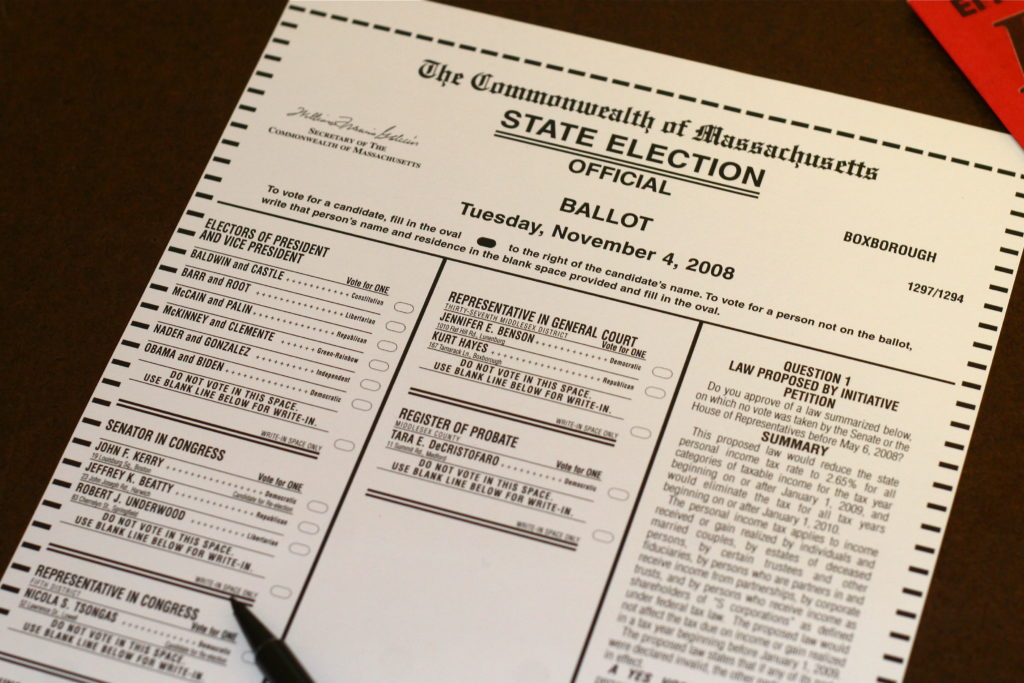 A photograph shows an example of a ballot form for a state election in Massachusettes.