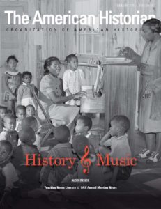 The February 2019 cover of The American Historian shows an image of singing children gathered around adults at a piano. The text reads "History and Music. Also Inside: Teaching News Literacy//OAH Annual Meeting News