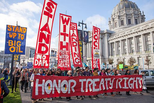 Protestors against the Dakota Access Pipeline march past San Francisco City Hall