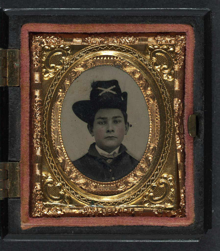 Gilt-edged framed photographic portrait of a boy in a Union Army Uniform. 